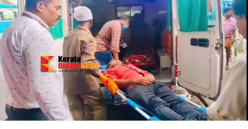 Passengers ignored a young man who collapsed at a bus stand in Thalassery, thinking he was drunk; Health Inspector who arrived on time came to his rescue