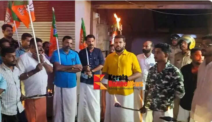 A protest demonstration involving the lighting of torches was held in front of Electricity Minister Sunny Joseph's office.
