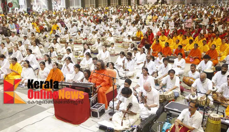Amritapuri on the occasion of Guru Purnima; Mata Amritanandamayi says that the duty of the Guru is to elevate the human mind from the state of 'I' to the state of 'we'