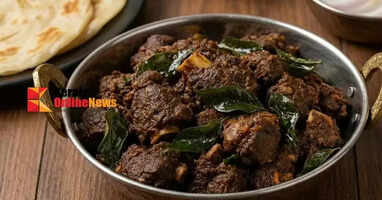 Delicious mutton fry made in Kerala style with coconut and curry leaves