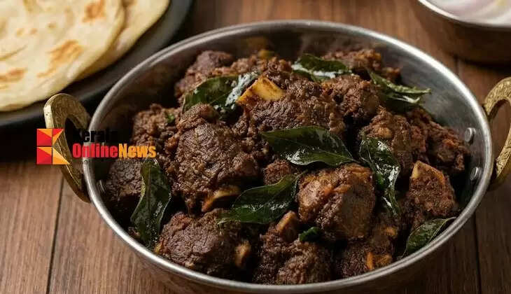 Delicious mutton fry made in Kerala style with coconut and curry leaves