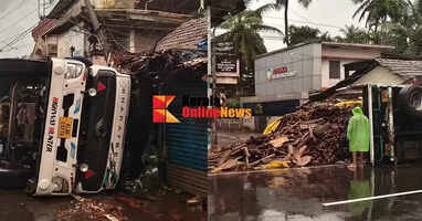 A lorry overturned after going out of control at Venus Junction in Thalassery; three shops, a bus stand and an electricity pole were damaged.