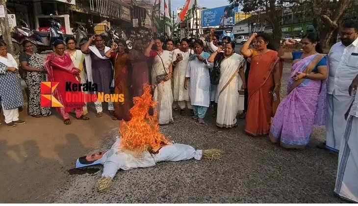 Postal employees march to Kannur Postal Superintendent's office
