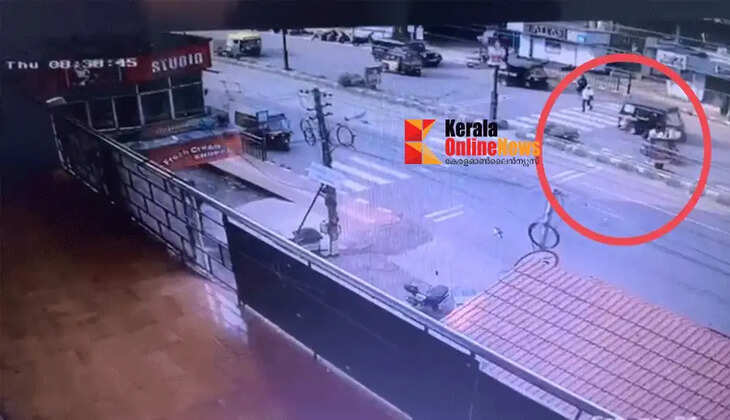 A young woman was knocked down and dragged by a motorcycle while crossing at a zebra crossing in Taliparamba.