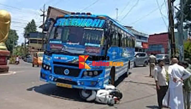 A scooter rider in Payyannur had a miraculous escape after ending up under a bus.