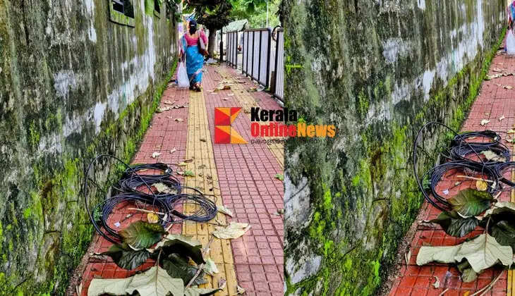 The removal of loose cables lying on the footpaths in Kannur has begun