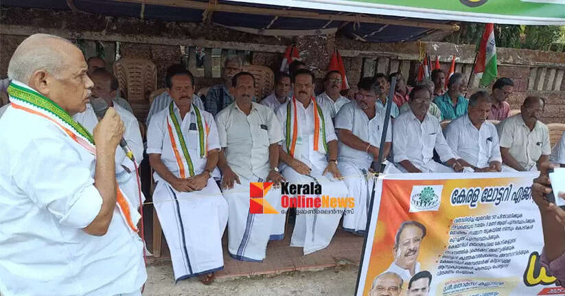 A march and dharna were held in Kannur to protest against the increase in lottery ticket prices