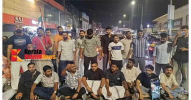 Protesters block the national highway in Kalpetta after police beat up MP Shafi Parambil