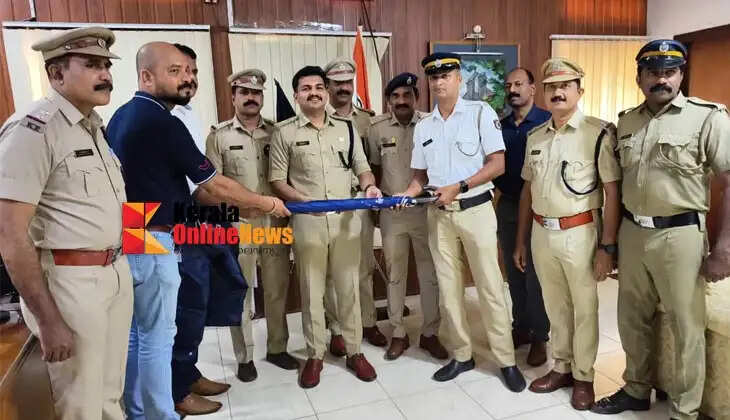 Raincoats and umbrellas distributed to police officers on traffic duty in Kannur